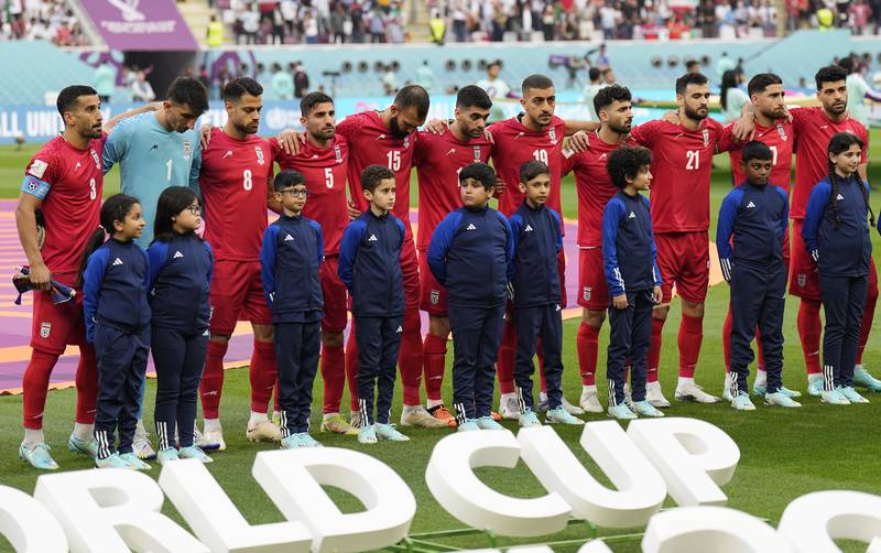 Iran's players stand in silence during their national anthem before their World Cup Group B match against England. AP