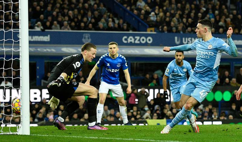 Manchester City's midfielder Phil Foden scores against Everton. AFP