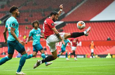 Manchester United's Portuguese midfielder Bruno Fernandes controls the ball during the English Premier League football match between Manchester United and Bournemouth at Old Trafford in Manchester, north west England, on July 4, 2020. RESTRICTED TO EDITORIAL USE. No use with unauthorized audio, video, data, fixture lists, club/league logos or 'live' services. Online in-match use limited to 120 images. An additional 40 images may be used in extra time. No video emulation. Social media in-match use limited to 120 images. An additional 40 images may be used in extra time. No use in betting publications, games or single club/league/player publications. / AFP / POOL / PETER POWELL / RESTRICTED TO EDITORIAL USE. No use with unauthorized audio, video, data, fixture lists, club/league logos or 'live' services. Online in-match use limited to 120 images. An additional 40 images may be used in extra time. No video emulation. Social media in-match use limited to 120 images. An additional 40 images may be used in extra time. No use in betting publications, games or single club/league/player publications.