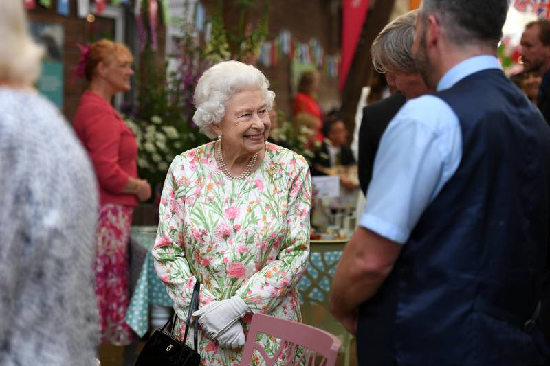 Queen Elizabeth II smiles as she meets people from communities across Cornwall during an event celebrating The Big Lunch initiative at the Eden Project during the G7 Summit. Getty Images