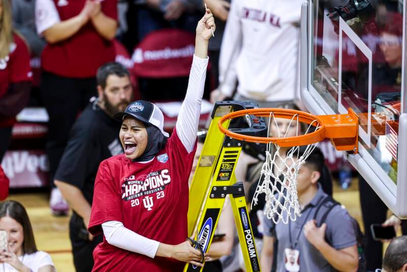 Kiandra Browne cuts the net after beating the Purdue Boilermakers. It is a tradition for teams reaching March Madness finals to keep a piece of net as a memento. Andrew Mascharka/Indiana Athletics