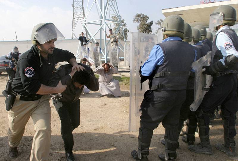 Iraqi police demonstrate riot control skills at the Mina Stadium in the southern city of Basra, in January 2006. AFP