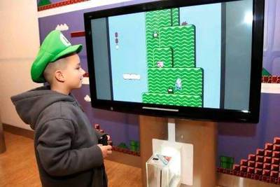 The music of Super Mario Bros might draw children to the symphony. Victoria Will / AP Images for Nintendo