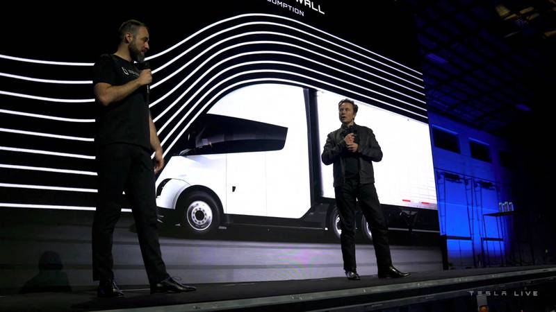 Tesla chief Mr Musk speaks with Dan Priestly, senior manager of Tesla Semi Truck Engineering, during the live-streamed unveiling of the Tesla semi electric lorry. Reuters
