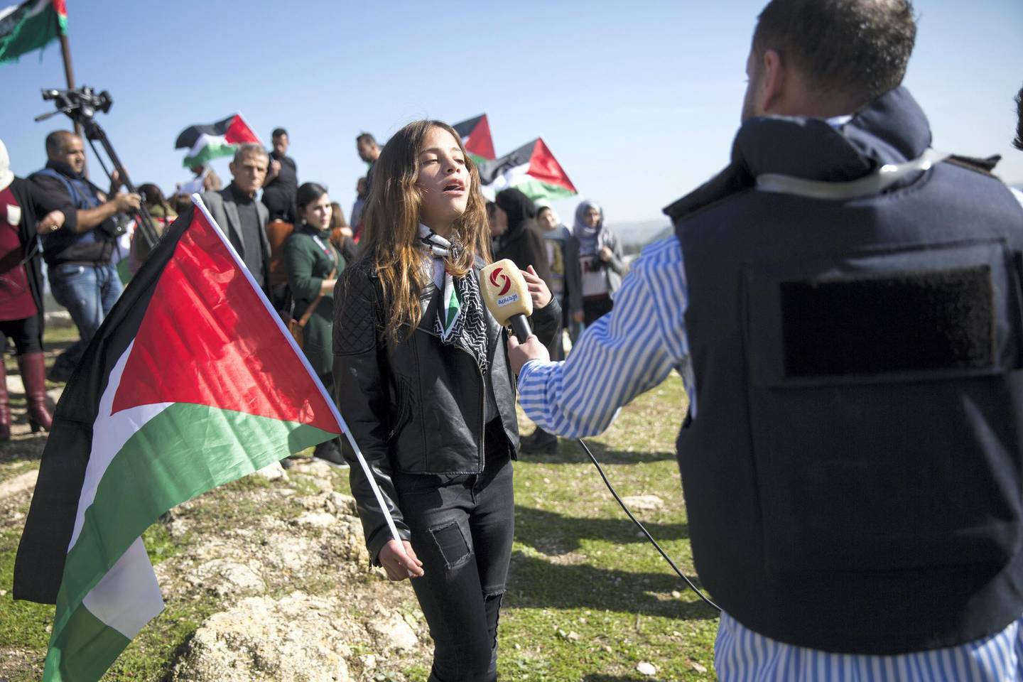 Janna Jihad Ayyad,11,described as Palestine's youngest journalist as she gives an interview during a demonstration held in Nabi Saleh in support of imprisoned Ahed Tamimi and others on January 13,2018. (Photo by Heidi Levine for The National).