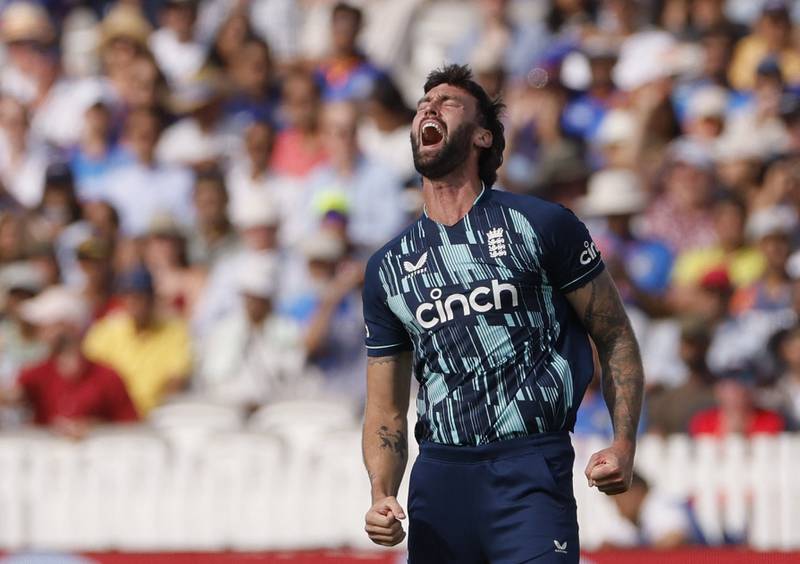 England's Reece Topley celebrates after taking the wicket of India captain Rohit Sharma for a duck. Reuters