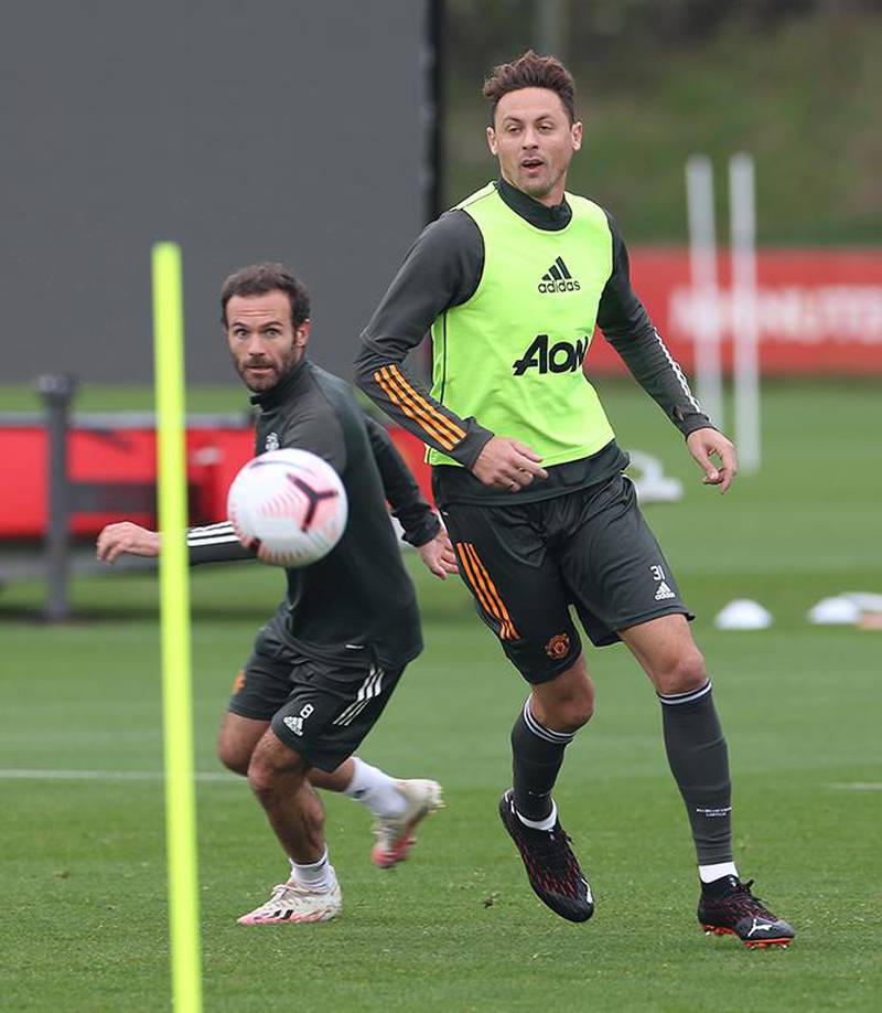 MANCHESTER, ENGLAND - OCTOBER 02: (EXCLUSIVE COVERAGE)  Juan Mata and Nemanja Matic of Manchester United in action during a first team training session at Aon Training Complex on October 02, 2020 in Manchester, England. (Photo by Matthew Peters/Manchester United via Getty Images)