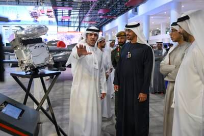 President Sheikh Mohamed and Sheikh Mansour with an exhibitor. 
Hamad Al Kaabi / UAE Presidential Court 