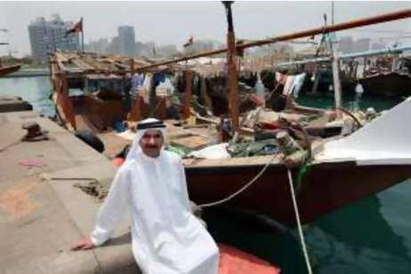 ABU DHABI. 10th July 2008.Retired local fisherman Darwish Rashid Lutah (60) amongst  the fishing boats in Dhow Harbour, Abu Dhabi. Story: Melanie Swan. Stephen Lock  /  The National.  *** Local Caption ***  SL-fisherman-003.jpg