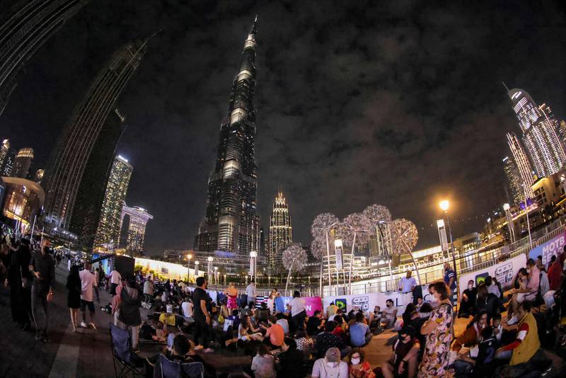 People wait for the New Year's Eve fireworks show at Burj Khalifa in Dubai. AFP