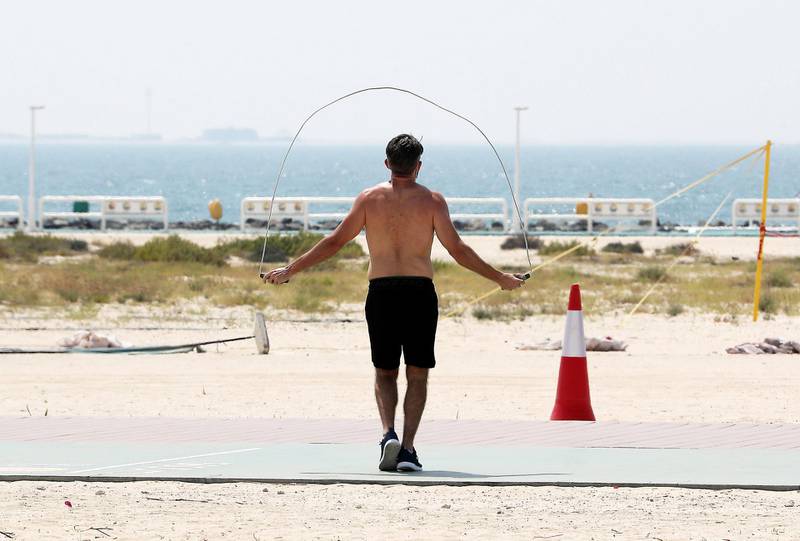 DUBAI, UNITED ARAB EMIRATES , May 21– 2020 :- One of the person skipping on the jogging track at the Jumeirah beach near the Sunset Mall in Dubai. (Pawan Singh / The National) For News/Online. 