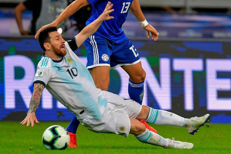Argentina's Lionel Messi is fouled by Paraguay's Junior Alonso. AFP