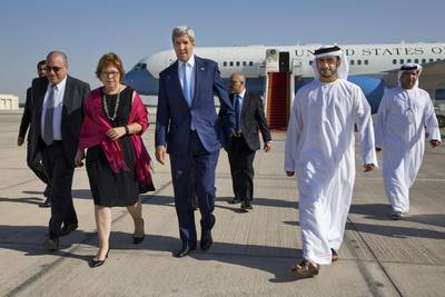 US Secretary of State John Kerry, third left, with Ms Leaf and Ethan Goldrich, deputy chief of mission at the US Embassy in Abu Dhabi. AP Photo