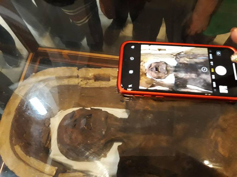 A tourist takes a photo of the "Screaming Mummy", known scientifically as "the unknown man E", on display at the Egyptian Museum in Cairo's Tahrir Square on February 14, 2018. Khaled Desouki / AFP