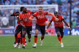 Players of Luton Town celebrate after Fankaty Dabo of Coventry City missed a penalty during a shootout that secured promotion to the Premier League for Luton Town in their Championship play-off final at Wembley Stadium on Saturday, May 27, 2023. Getty
