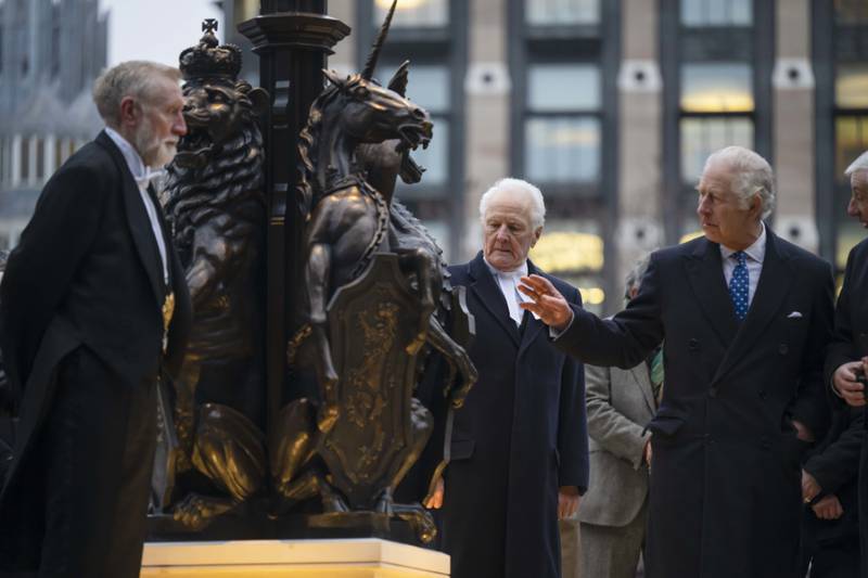 King Charles III (right) in the Houses of Parliament to unveil a plaque marking the place of the lying-in-state of the late Queen Elizabeth II. PA