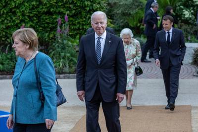 US President Joe Biden and German Chancellor Angela Merkel arrive at a drinks reception for Queen Elizabeth II and G7 leaders at the Eden Project during the G7 summit. Getty Images