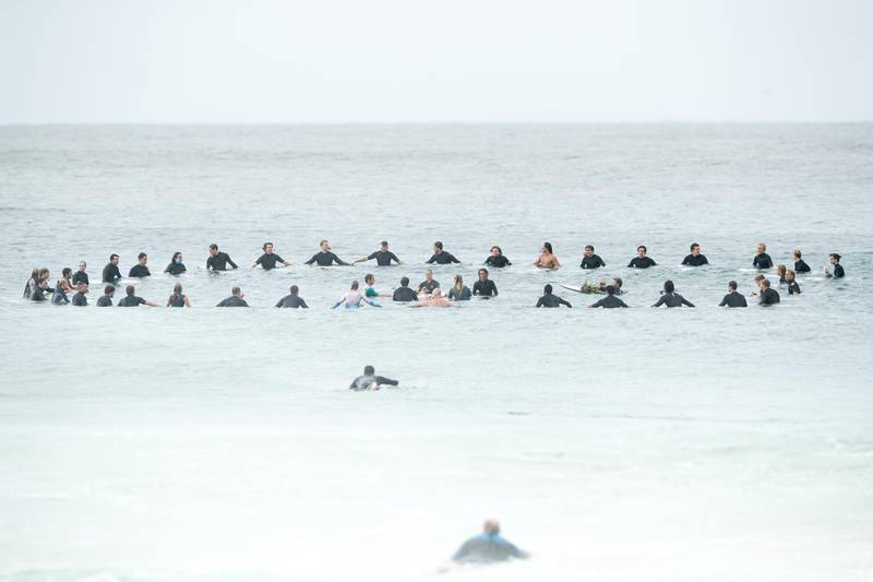 Surfers competing in the Sydney Surf Pro participate in a paddle-out, wreath laying and observe a minute of silence to remember victims of the Christchurch mosque attacks at Manly Beach on March 17, 2019 in Sydney, Australia. Getty Images