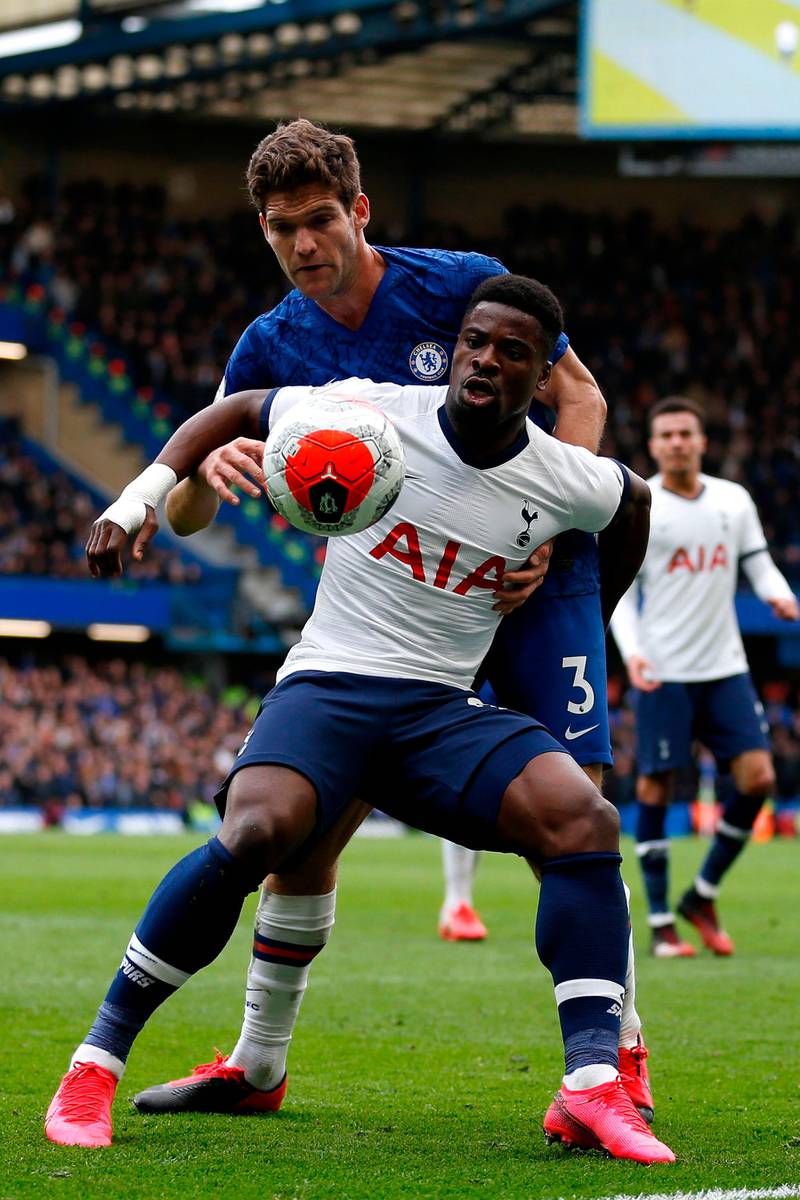 Tottenham Hotspu defender Serge Aurier vies with Chelsea defender Marcos Alonso (back). AFP