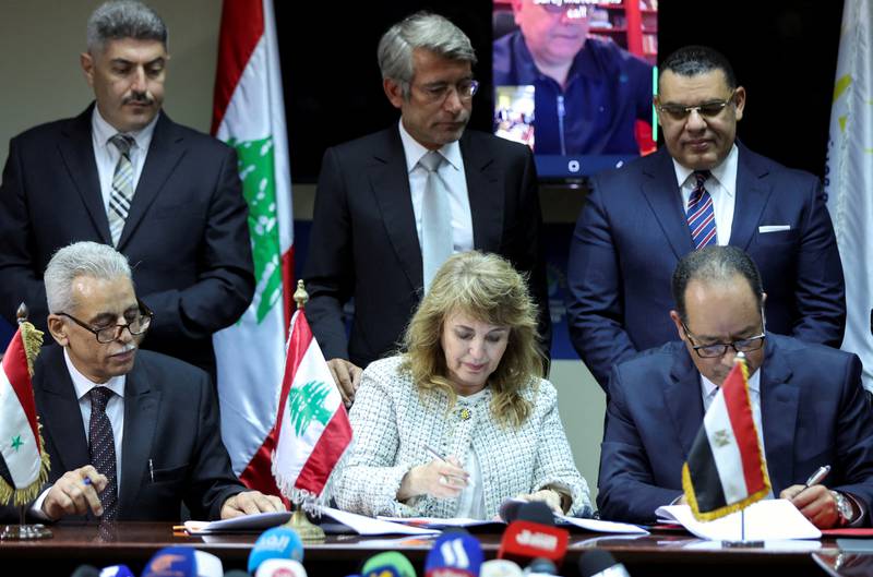 Aurore Feghali, of the Lebanese Energy Ministry, Magdy Galal, chairman of the Egyptian Natural Gas Holding Company and Nabih Khrestin, of the Syrian General Petroleum Corporation, sign the deal in Beirut. Reuters