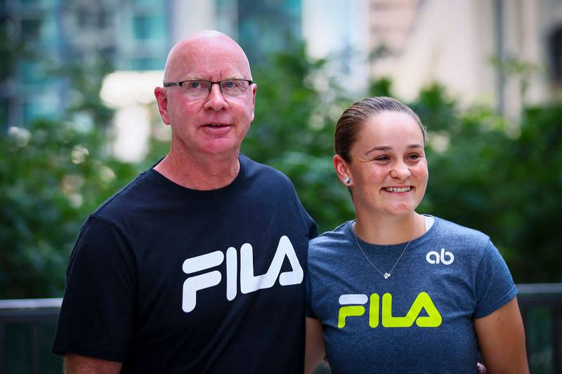Ashleigh Barty with her coach Craig Tyzzer during a press conference in Brisbane on March 24, 2022, after she announced her retirement from tennis.  AFP