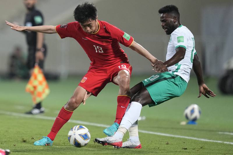 China's Yang Liu and Saudi Arabia's Abdulaziz Al Beshi fight for the ball. AP