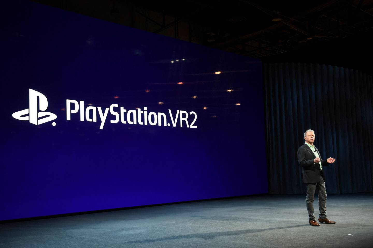 Jim Ryan, Sony Interactive Entertainment president and chief executive officer, speaks about PlayStation VR2 during the Sony press conference ahead of the Consumer Electronics Show (CES) on January 4, 2022 in Las Vegas, Nevada.  - The Consumer Electronics Show (CES), one of the world's largest trade fairs, returns to Las Vegas in person this week under a newly resurgent pandemic that has supercharged the industry but threatens its downsized expo. 
Masks and proof of vaccination are required at the show that opens Wednesday and was trimmed by one day to end Friday, with expected exhibitors down more than half to roughly 2,200 from the last in-person CES.  (Photo by Patrick T.  FALLON  /  AFP)