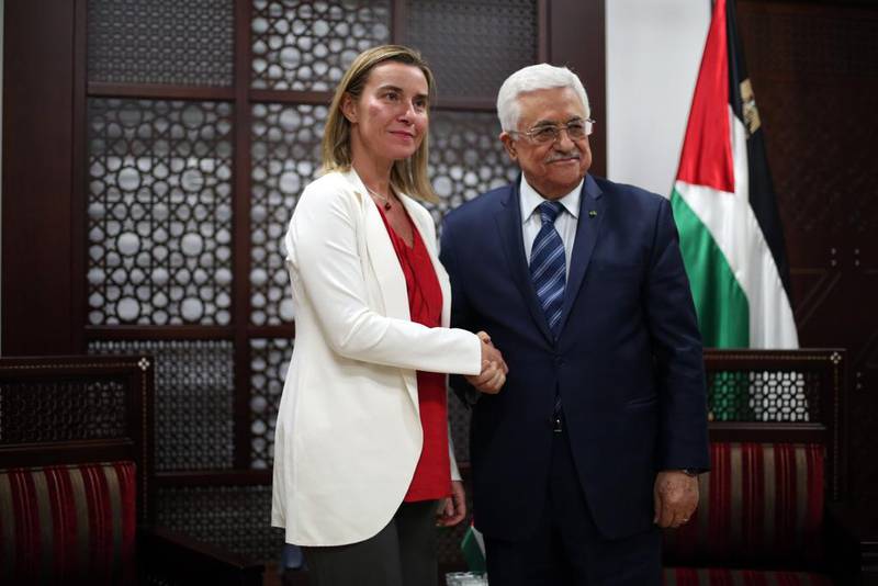 Palestinian president Mahmoud Abbas poses for a picture with the European Union's new foreign affairs chief Federica Mogherini in the West Bank town of Ramallah on November 8. Abbas Momani / AFP

