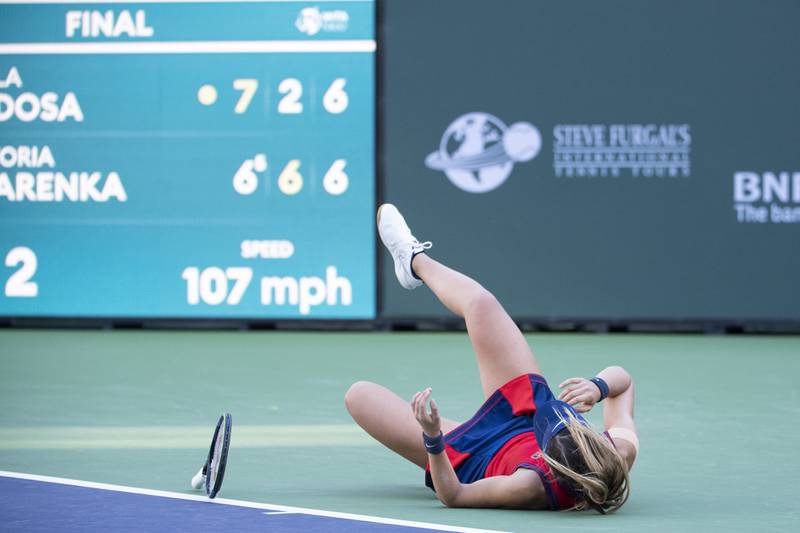 Paula Badosa drops to the ground after defeating Victoria Azarenka. AP Photo