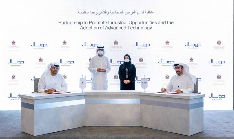 The UAE Ministry of Industry and Advanced Technology and Dubal Holding officials sign an agreement to explore potential opportunities. Photo: MoIAT