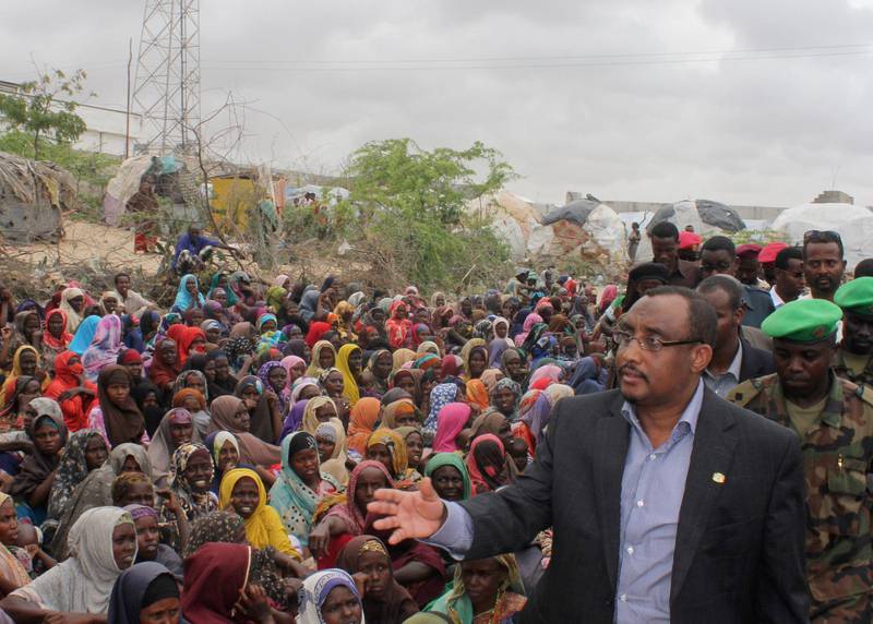 Somali prime minister Abdiwali Mohamed Ali, right,  visiting  the largest displaced persons camp in Mogadishu,  to assess the scale of drought victims flooding into the capital of Mogadishu Tuesday, July 26, 2011.  The U.N. will airlift emergency rations this week to parts of drought-ravaged Somalia that militants banned it from more than two years ago _ a crisis intervention to keep hungry refugees from dying along what an official calls the "roads of death." (AP Photo)