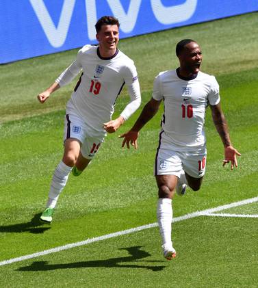 England's Raheem Sterling, right, reacts as he celebrates with teammate Mason Mount after scoring his team's first goal during the Euro 2020 soccer championship group D match between England and Croatia at Wembley stadium in London, Sunday, June 13, 2021. (AP Photo/Justin Tallis, Pool)