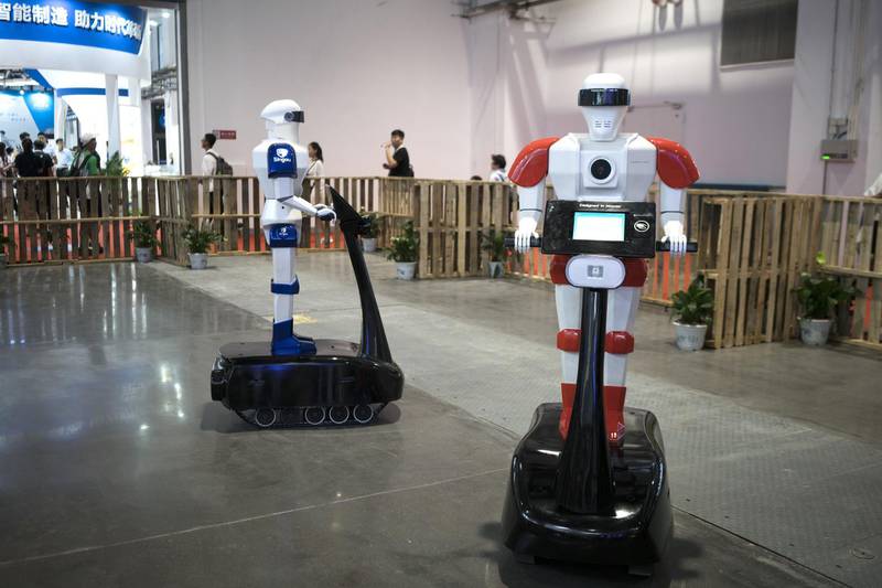 Singou Technology Ltd. Singou Guard 1 robots participate in a demonstration at the World Robot Conference in Beijing, China, on Thursday, Aug. 16, 2018. The conference runs through to Aug. 19. Photographer: Giulia Marchi/Bloomberg