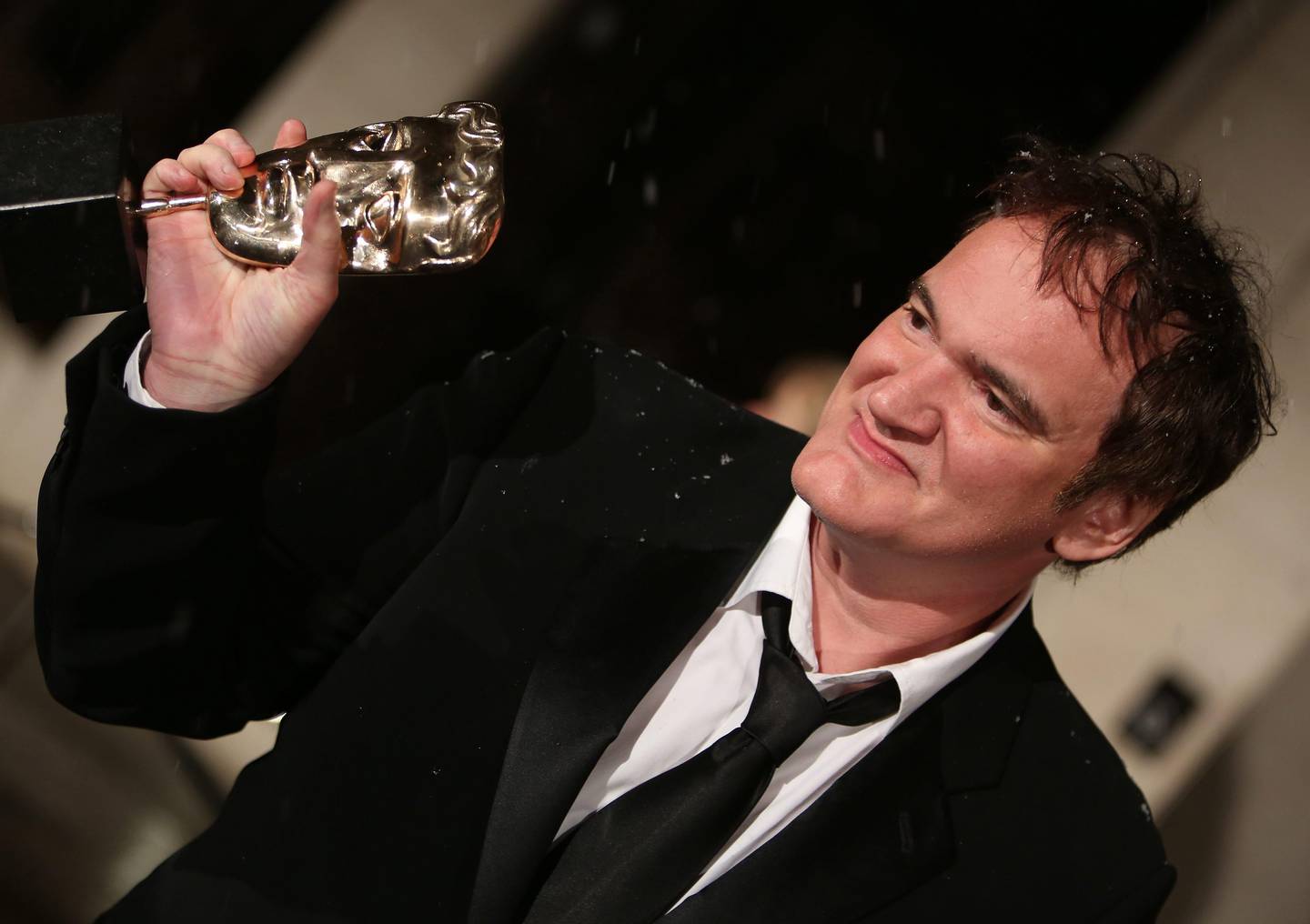 epa03578094 US director Quentin Tarantino poses with his Original Screenplay BAFTA for his western 'Django Unchained' as he arrives at the Official After Party for the British Academy Film Awards (BAFTA) at the Grosvenor House in London, Britain, 10 February 2013.  EPA/KAREL PRINSLOO *** Local Caption ***  03578094.jpg