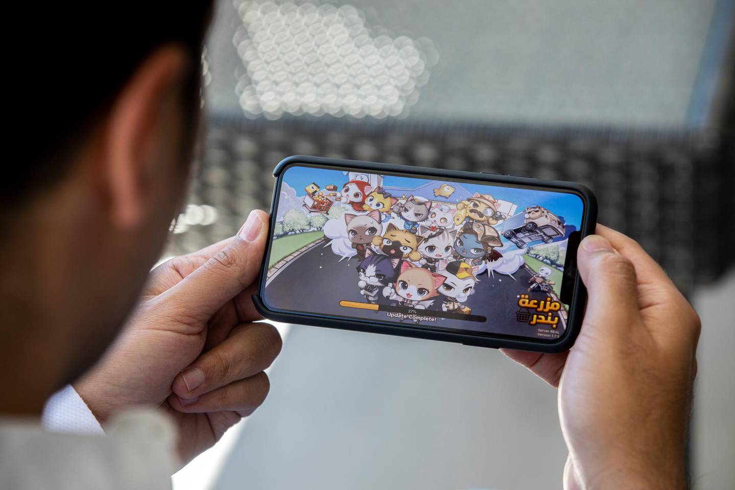 Jordanian Hussam Hammo, Founder and Chief Executive of Tamatem,an Arabic video games publisher plays on one of his games at his home office in Amman, Jordan, 24 June 2020.