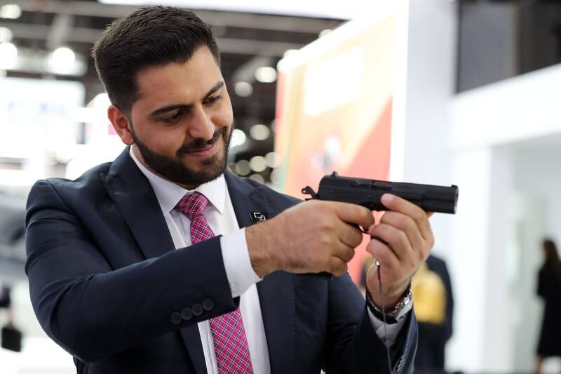 Hafez Jawabreh looks at a Kilinc 2000 Light handgun at the Sarsilmaz stand