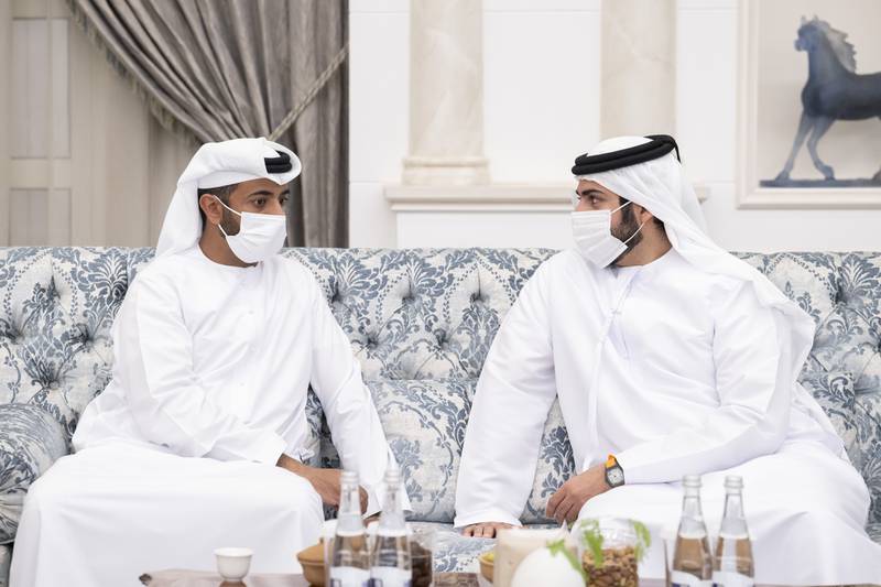 Sheikh Mohamed bin Sultan, right, and Sheikh Mohamed bin Nahyan attend an event to accept condolences for the late Sheikh Khalifa.