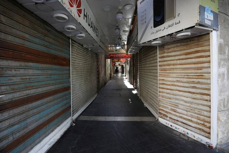 Closed shops are seen during the nationwide curfew for two days, amid fears of a rising number of coronavirus disease (COVID-19) cases in downtown Amman, Jordan. REUTERS