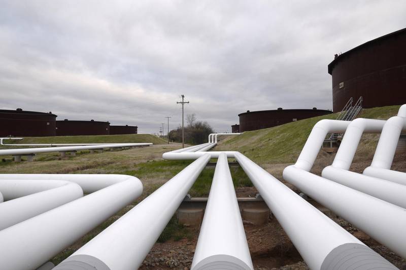 FILE PHOTO: Pipelines run to Enbridge Inc.'s crude oil storage tanks at their tank farm in Cushing, Oklahoma, March 24, 2016. REUTERS/Nick Oxford/File Photo