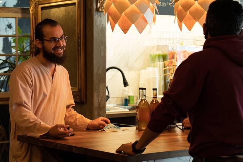 Mohamad Hafez speaks with a customer at Pistachio. Sophie Tremblay / The National