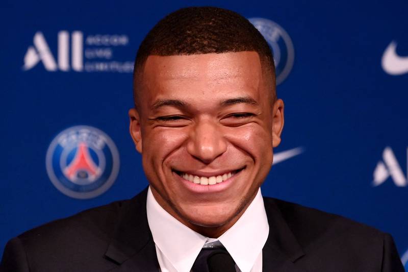 Kylian Mbappe smiles during a press conference at the Parc des Princes. AFP