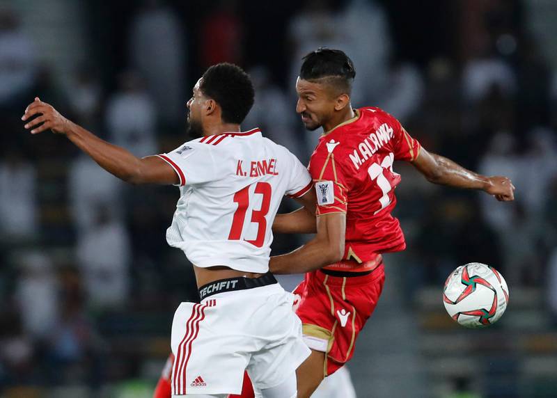 United Arab Emirates' midfielder Khamis Esmaeel, left, and Bahrain's forward Mohamed Al Romaihi challenge for the ball. AP Photo