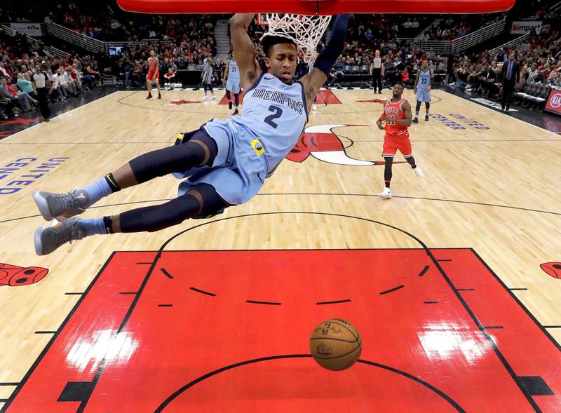 Memphis Grizzlies' Kobi Simmons dunks the ball during the second half of an NBA basketball game against the Chicago Bulls. Charles Rex Arbogast / AP Photo