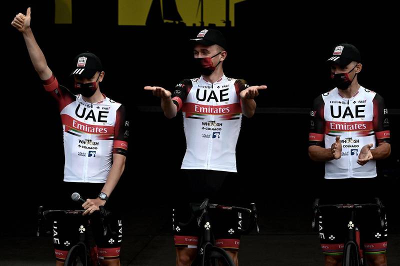 Tadej Pogacar, centre, and UAE Team Emirates teammates attend the team's presentation two days ahead of the 108th edition of the Tour de France. AFP