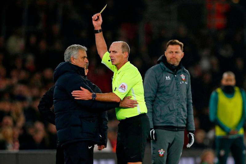 Southampton's Austrian manager Ralph Hasenhuttl (R) looks on a English referee Mike Dean shows Tottenham Hotspur's Portuguese head coach Jose Mourinho (L) a yellow card during the English Premier League football match between Southampton and Tottenham at St Mary's Stadium in Southampton, southern England on January 1, 2020. RESTRICTED TO EDITORIAL USE. No use with unauthorized audio, video, data, fixture lists, club/league logos or 'live' services. Online in-match use limited to 120 images. An additional 40 images may be used in extra time. No video emulation. Social media in-match use limited to 120 images. An additional 40 images may be used in extra time. No use in betting publications, games or single club/league/player publications.
 / AFP / Adrian DENNIS / RESTRICTED TO EDITORIAL USE. No use with unauthorized audio, video, data, fixture lists, club/league logos or 'live' services. Online in-match use limited to 120 images. An additional 40 images may be used in extra time. No video emulation. Social media in-match use limited to 120 images. An additional 40 images may be used in extra time. No use in betting publications, games or single club/league/player publications.
