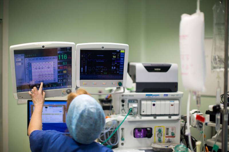 FILE: An anaesthetist monitors a patient's heart rate and other data displayed on electronic monitors during an operation inside a theater at Queen Elizabeth Hospital Birmingham, part of the University Hospitals Birmingham NHS Foundation Trust, in Birmingham, U.K., on Monday, Feb. 20, 2017. As the U.K. government proposes spending 160 million pounds ($207 million) to support medical research and health care we select our best archive images on health. Photographer: Matthew Lloyd/Bloomberg