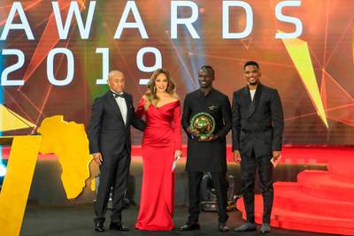Senegal winger Sadio Mane (C-R) poses for a picture with Ahmad Ahmad (L), President of the Confederation of African Football, and former Cameroonian forward Samuel Eto'o (R) after winning the Player of the Year award. AFP