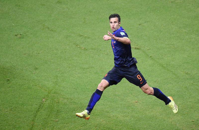 Robin van Persie celebrates his first goal against Spain on Friday night in their 2014 World Cup Group B opening match. Netherlands went down 1-0 but roared back for a 5-1 victory. Dimitar Dilkoff / AFP / June 13, 2014