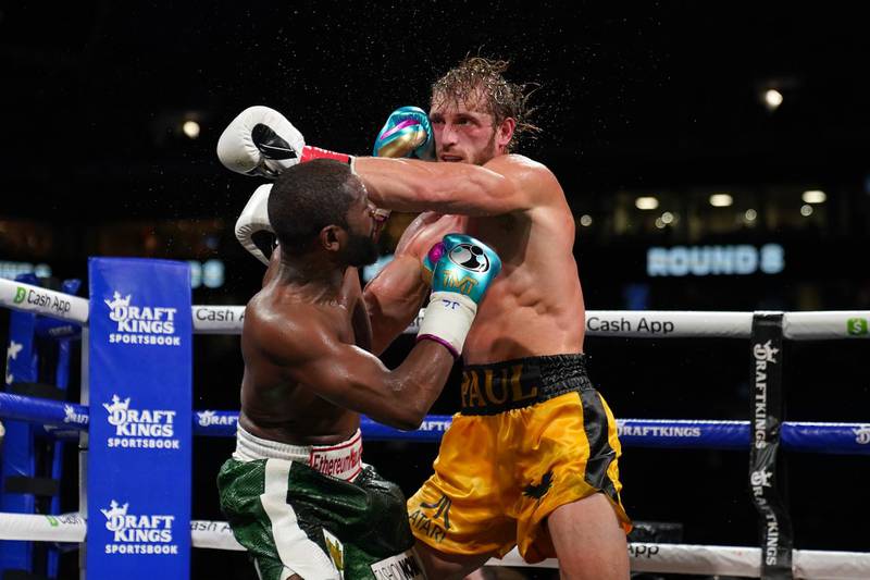 Floyd Mayweather Jr. and Logan Paul trade punches during an exhibition bout at Hard Rock Stadium. Reuters