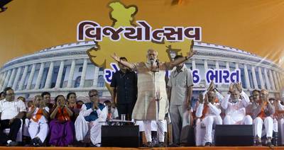 Narendra Modi addresses a public meeting in Ahmedabad, Gujarat, as his Hindu nationalist Bharatiya Janata Party raced towards an absolute majority in India’s parliamentary polls on May 16, 2014.  Divyakant Solanki / EPA